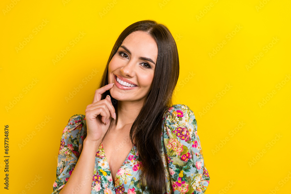 Photo of pretty lovely lady dressed in bright clothes hand touch chin showing bright white smile isolated on yellow color background Photo of pretty lovely lady dressed in bright clothes hand touch chin showing bright white smile isolated on yellow color background