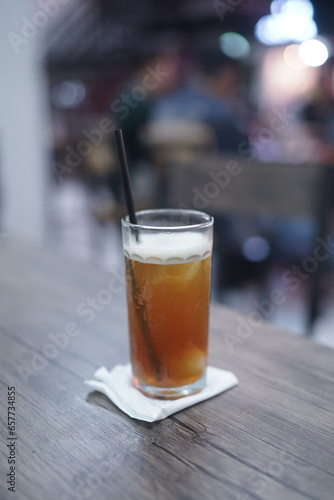 Lychee tea or lychee tea. Iced Tea or Fresh Drink in a glass with a cafe background
