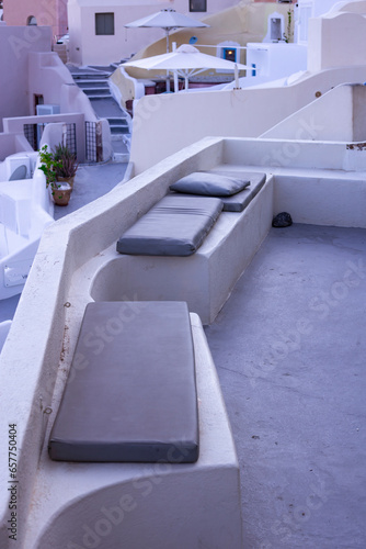 Apartment balcony in a white luxurious resort with great views of the Santorini Island shore Mediterranean Sea © jordieasy