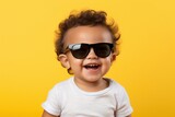 Tiny Trendsetter: Surprised Baby Boy Stylishly Posing in Cool Sunglasses with Innocence and Wonder