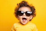 Spectacled Charm: Surprise on the Little Face, Baby Boy Dons Adorable Sunglasses for a Sweet Capture