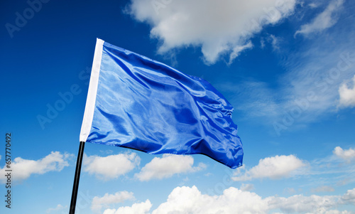 Blue flag waving on sky