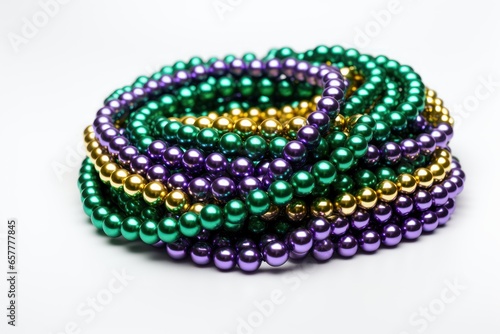 Mardi gras beads necklace isolated on white closeup, Carnival tradition photo