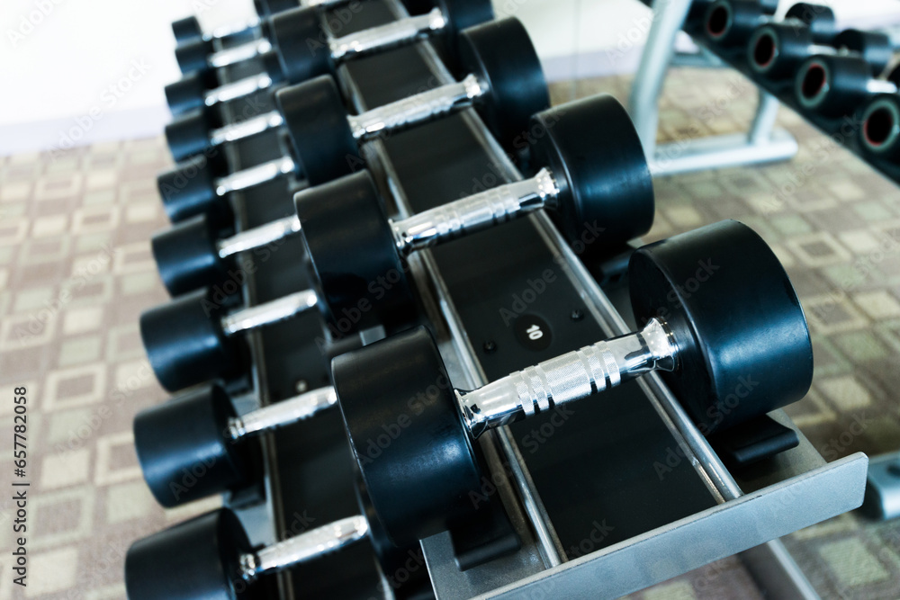 Obraz premium Rows of dumbbells in the gym