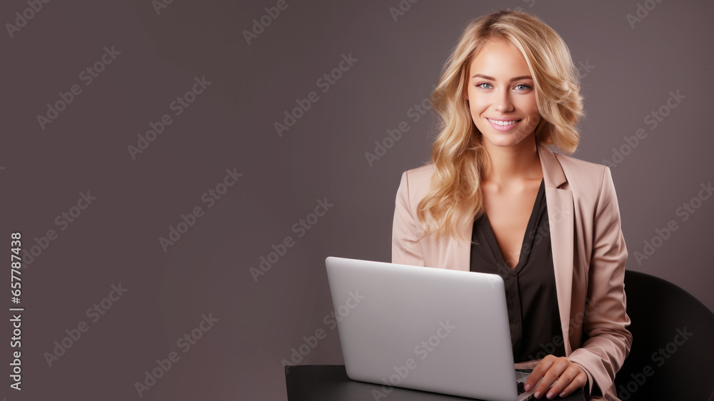 Smiling blonde businesswoman holding laptop computer Smiling blonde businesswoman holding laptop computer