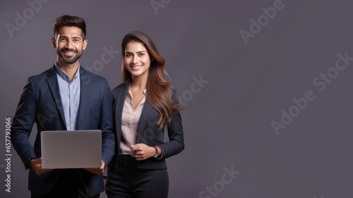 Two professionals are presenting using laptop computers