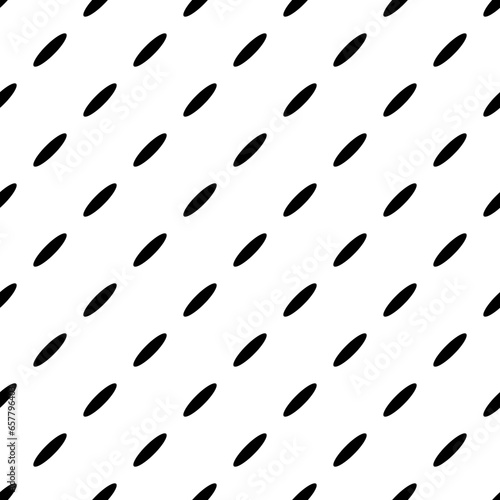 Abstract seamless pattern with black dotted diagonal lines from ovals