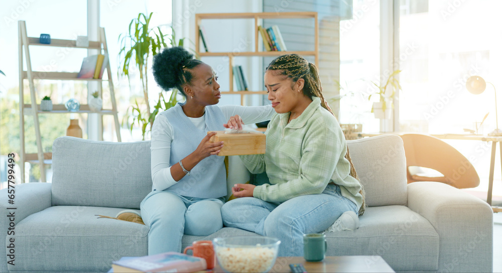 Woman, friends and sad on sofa in living room with support, empathy or comfort for divorce. African, people and together for talk, crying and compassion for loss, grief or stress with understanding Woman, friends and sad on sofa in living room with support, empathy or comfort for divorce. African, people and together for talk, crying and compassion for loss, grief or stress with understanding