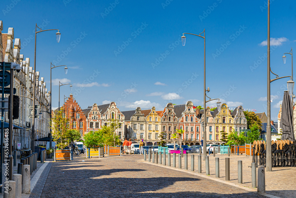 Arras cityscape with Flemish-Baroque-style townhouses buildings on La Grand Place square in old town center, blue sky in summer day, Pas-de-Calais department, Hauts-de-France Region, Northern France