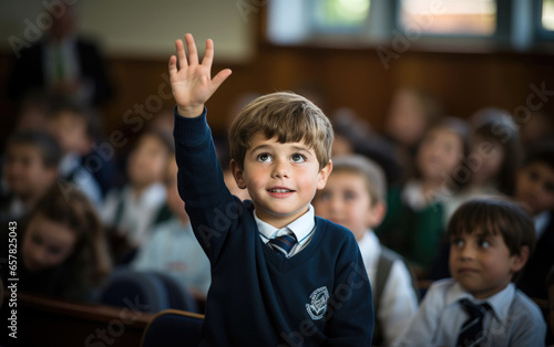 A schoolboy is raising his ...