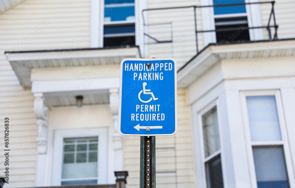 handicap wheelchair-accessible sign against a blurred background ...