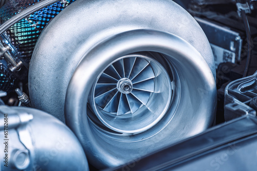 Close up of Turbo charger installed on car engine for power booster torque drive, Turbo car engine showing inner parts and turbine.