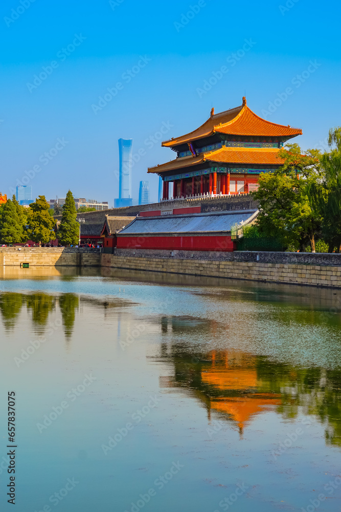 View of the Forbidden City with the reflection on the moat on a sunny day in Beijing, China. View of the Forbidden City with the reflection on the moat on a sunny day in Beijing, China.
