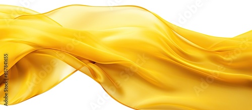 Yellow transparent fabric flying on white background with a smooth texture photo
