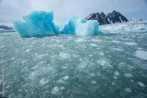 Pack ice off the cliff of the Monacobreen Glacier; Spitsbergen, Svalbard, Norway photo