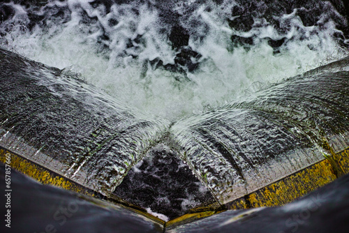 water flowing out of the canal lock