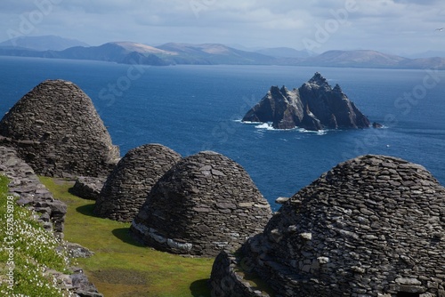 Skellig Michael, County Kerry, Ireland; Stone 'beehive' Monk Huts (Clochans) With A View Of Skellig Beag photo