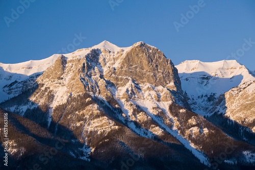Snow-Capped Mountain At Sunrise; Canmore, Alberta, Canada