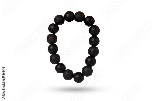 Shungite bracelet on a technical white background. Natural beauty and energy in one accessory