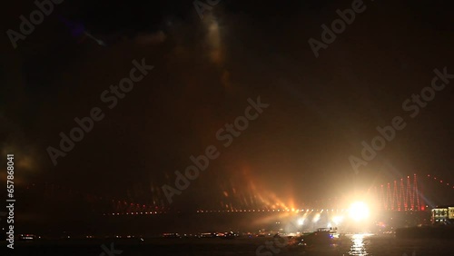 Light beams over Bosporus Bridge on October, 29 Festival Day in Istanbul, Turkey. Bosporus Bridge during the light show
 photo