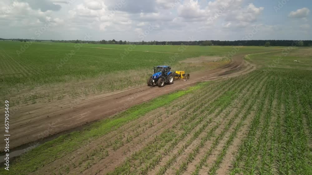 Grader works with tractor and levels the field road Grader works with tractor and levels the field road