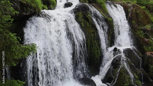 Beautiful view of the mountain waterfall. photo