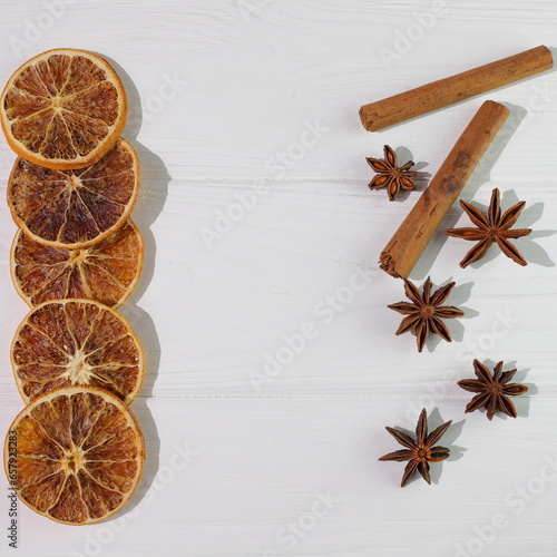 Orange Cinnamon Anise on white wooden background, christmas decoration
