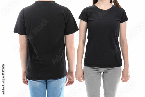 Young couple in black t-shirts on white background