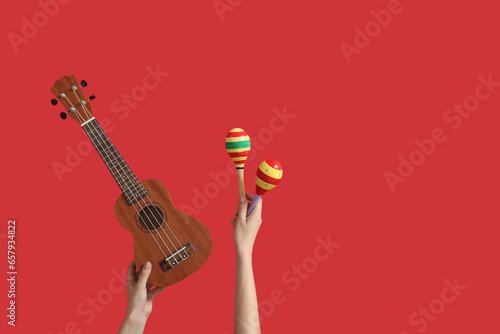 Female hands holding ukulel...