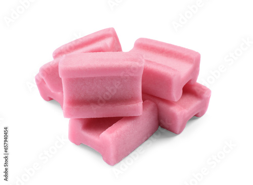 Many tasty pink chewing gums on white background