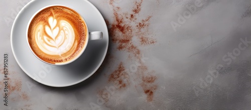 Tasty cappuccino cup on stone table