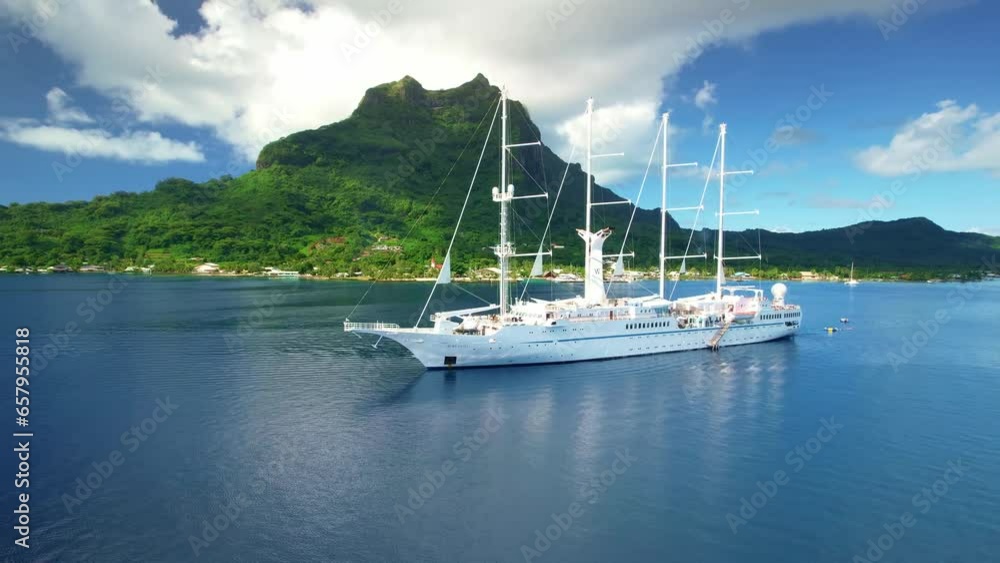 Drone Tahiti. Aerial view of Bora Bora mountain. Tropical paradise, vacation in French Polynesia, exotic travel. Sail cruise ship in lagoon. Drone Tahiti. Aerial view of Bora Bora mountain. Tropical paradise, vacation in French Polynesia, exotic travel. Sail cruise ship in lagoon.