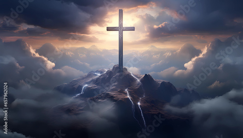 a cross is seen rising out of clouds above a mountain photo