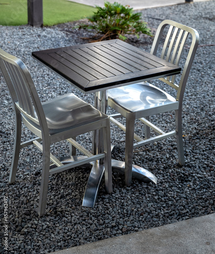 Silver Chrome Metal Chair Set with a Black Topped Table.
