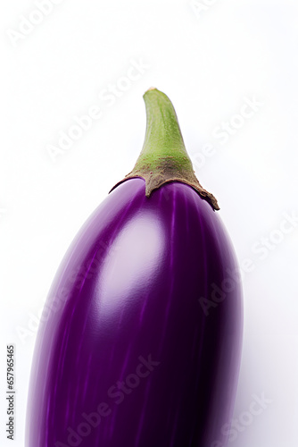 A minimalist close-up shot of a single slice of deep purple eggplant placed at an angle on a pristine white background. photo