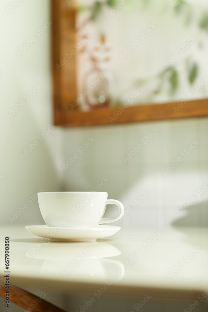 A comfortable room where warm afternoon sunlight
comes in through a window with a view of tree leaves