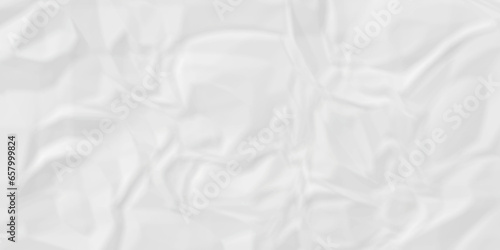 Crumpled wrinkled white paper texture. White crumpled paper texture crush paper so that it becomes creased and wrinkled. Old white crumpled paper sheet background texture.	