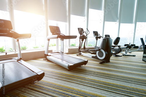Modern gym with many treadmills