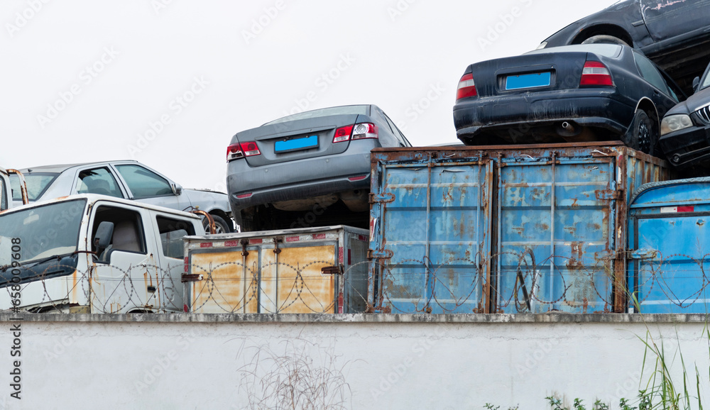 A pile of abandoned cars on junkyard A pile of abandoned cars on junkyard