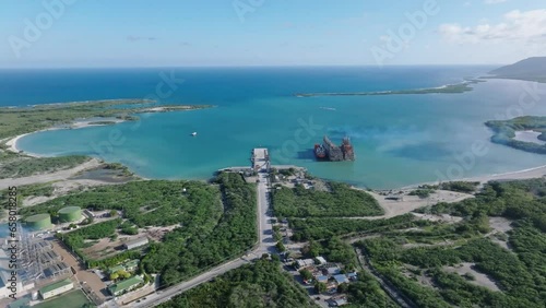 Floating power plant of MV Karadeniz Powership Irem Sultan, Azua in Dominican Republic. Aerial drone panoramic view and space for copy photo