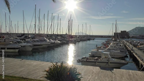 Calpe Spain late afternoon sunshine on boats in the Marina on a warm winter day photo