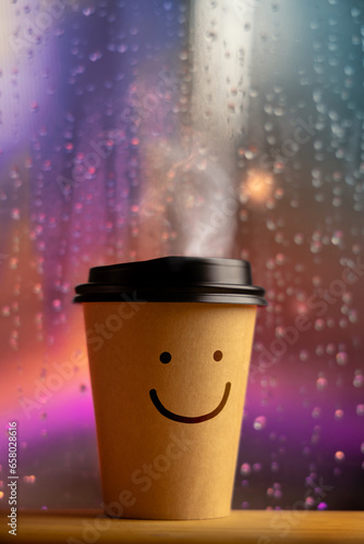 Enjoying the Harmony Life, Optimistic Mind Concept. Smiling Face on Coffee Cup. Happy Mood even if Bad Rainy Day. Serene, Balancing Mind, Soul and Spirit. Mental Health Practice