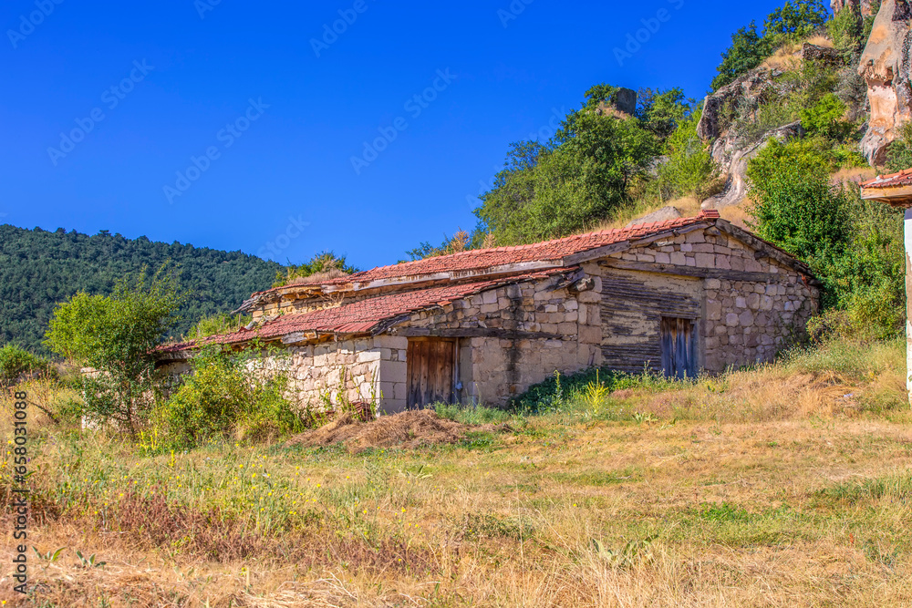 Abandoned village house with bricks walls and an red-tiled roof Abandoned village house with bricks walls and an red-tiled roof