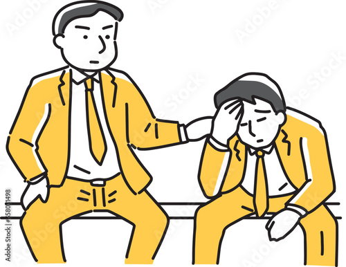 落ち込む男性を慰める会社員
