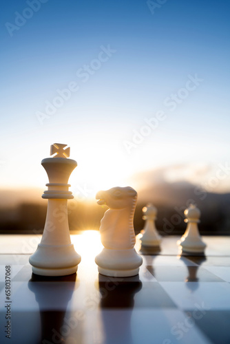 Chess king, knight and pawns on city background