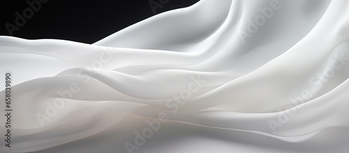 White fabric cloth flowing on white background shown in close up photo
