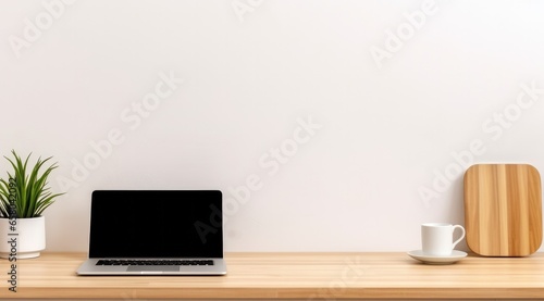 Laptop mock up on wooden blotchy white table.