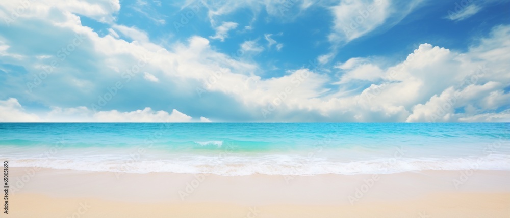 Fototapeta premium Blurred Tropical Beach Paradise: Golden Sand, Turquoise Ocean, and Blue Sky