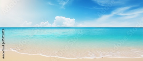 Blurred Tropical Beach Paradise: Golden Sand, Turquoise Ocean, and Blue Sky