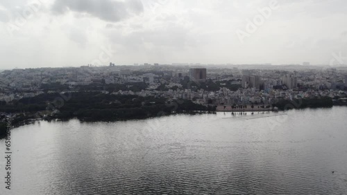 Aerial shot of an artificial lake that holds water perennially fed by canals from Musi river. Hussain Sagar was the main source of water supply to Hyderabad. photo
